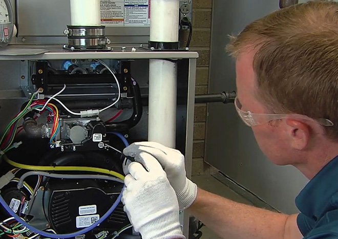 Technician working on boiler